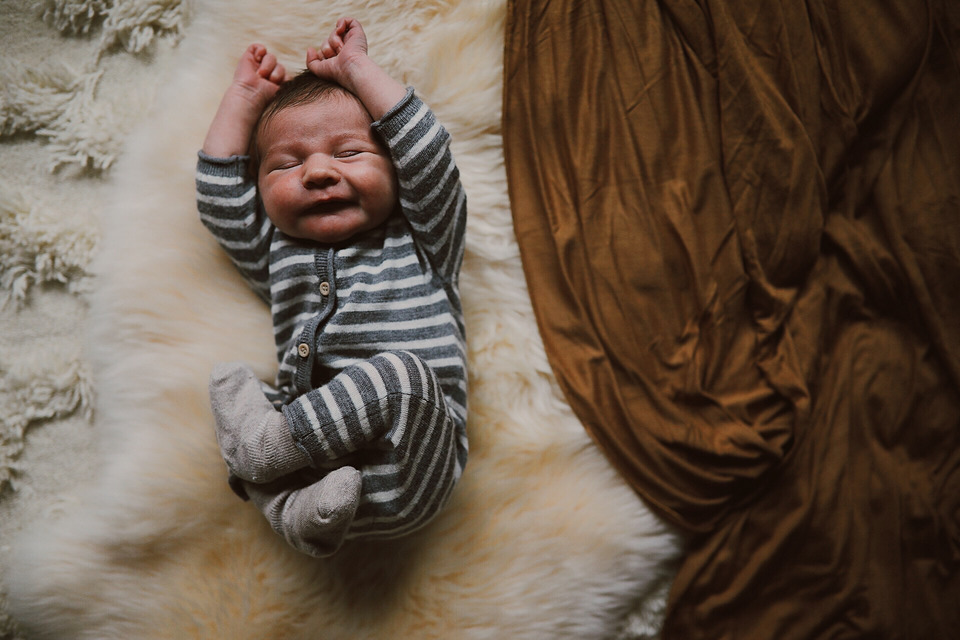 newborn baby boy in striped pajamas