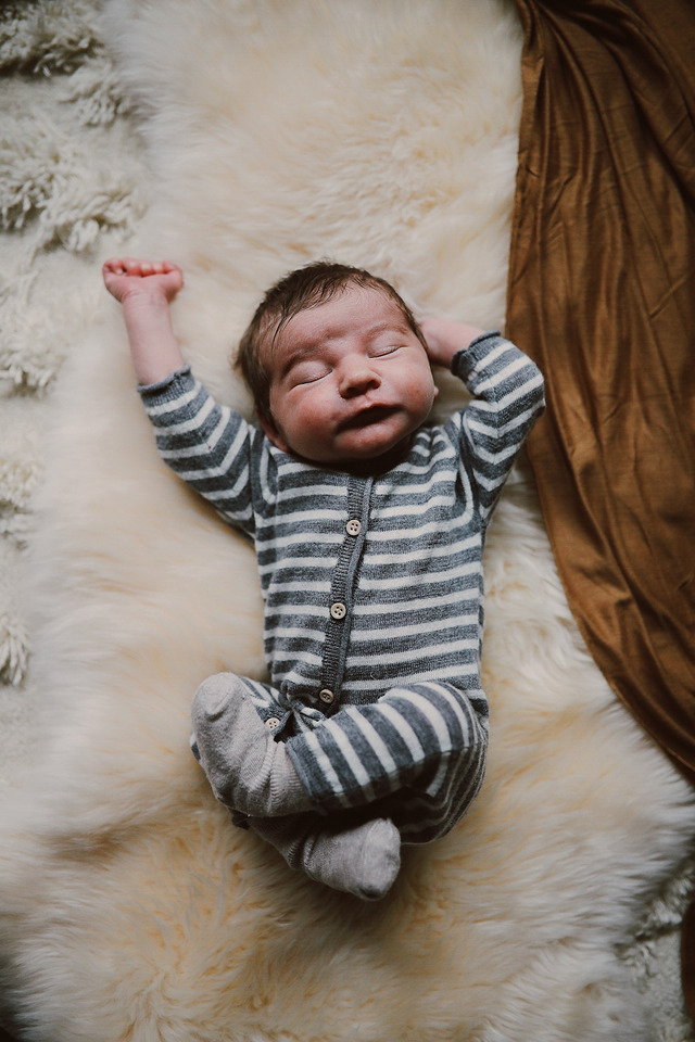 newborn baby boy in striped pajamas