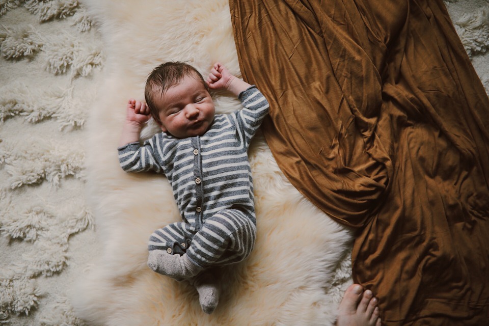 newborn baby boy in striped pajamas
